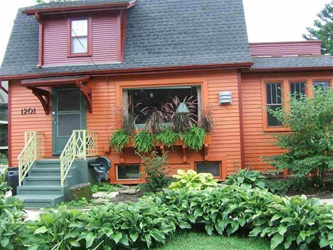 orange house with green door exterior