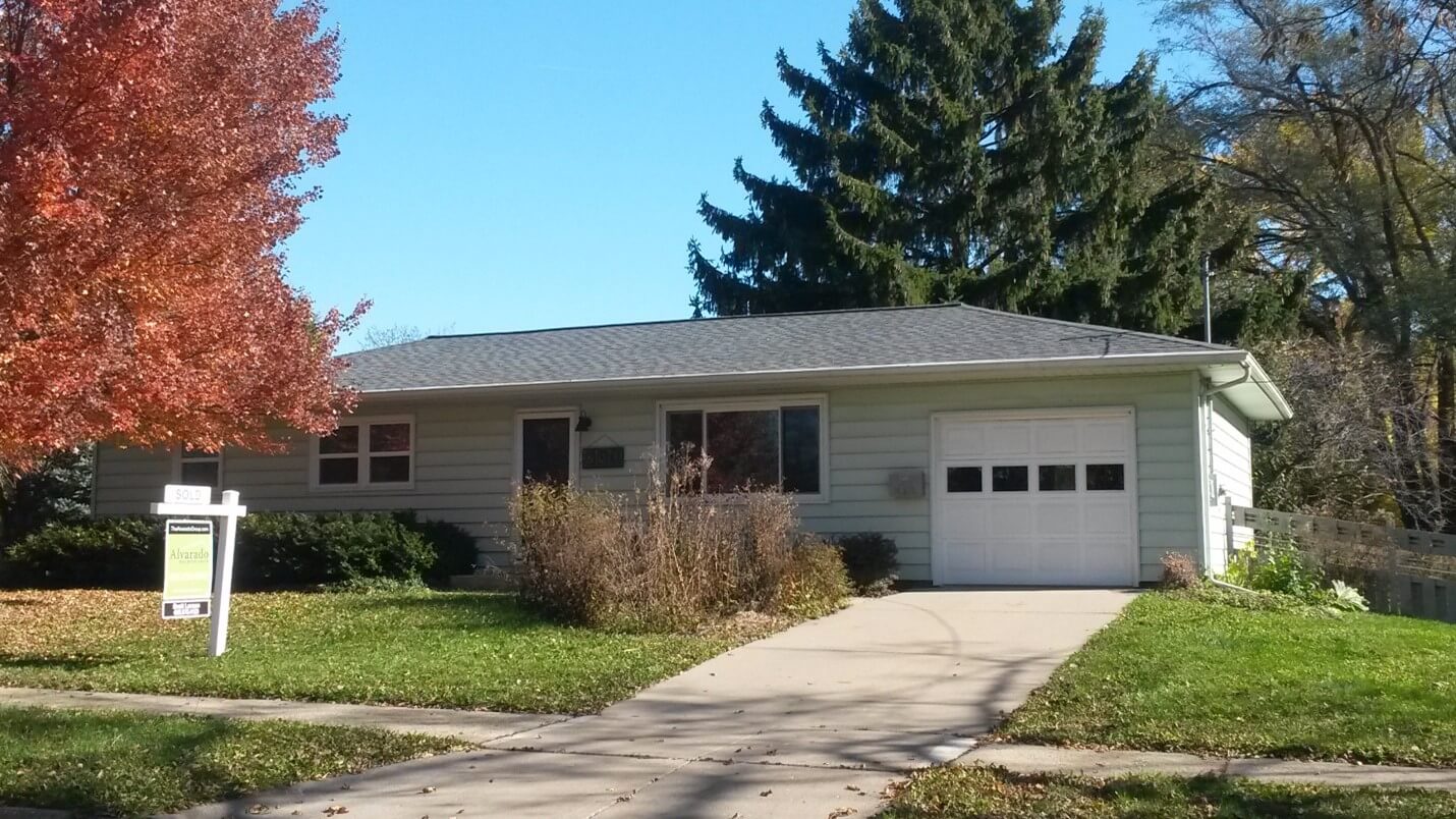 grey house exterior with single car garage