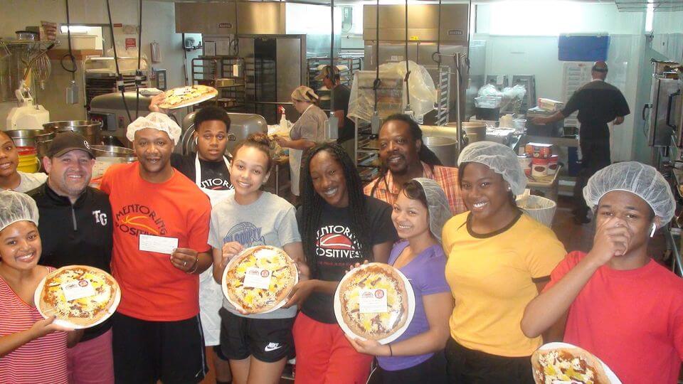 Mentoring Positives Off the Block pizza staff